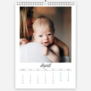 Close-up of a mother holding her crying baby in April calendar photo.