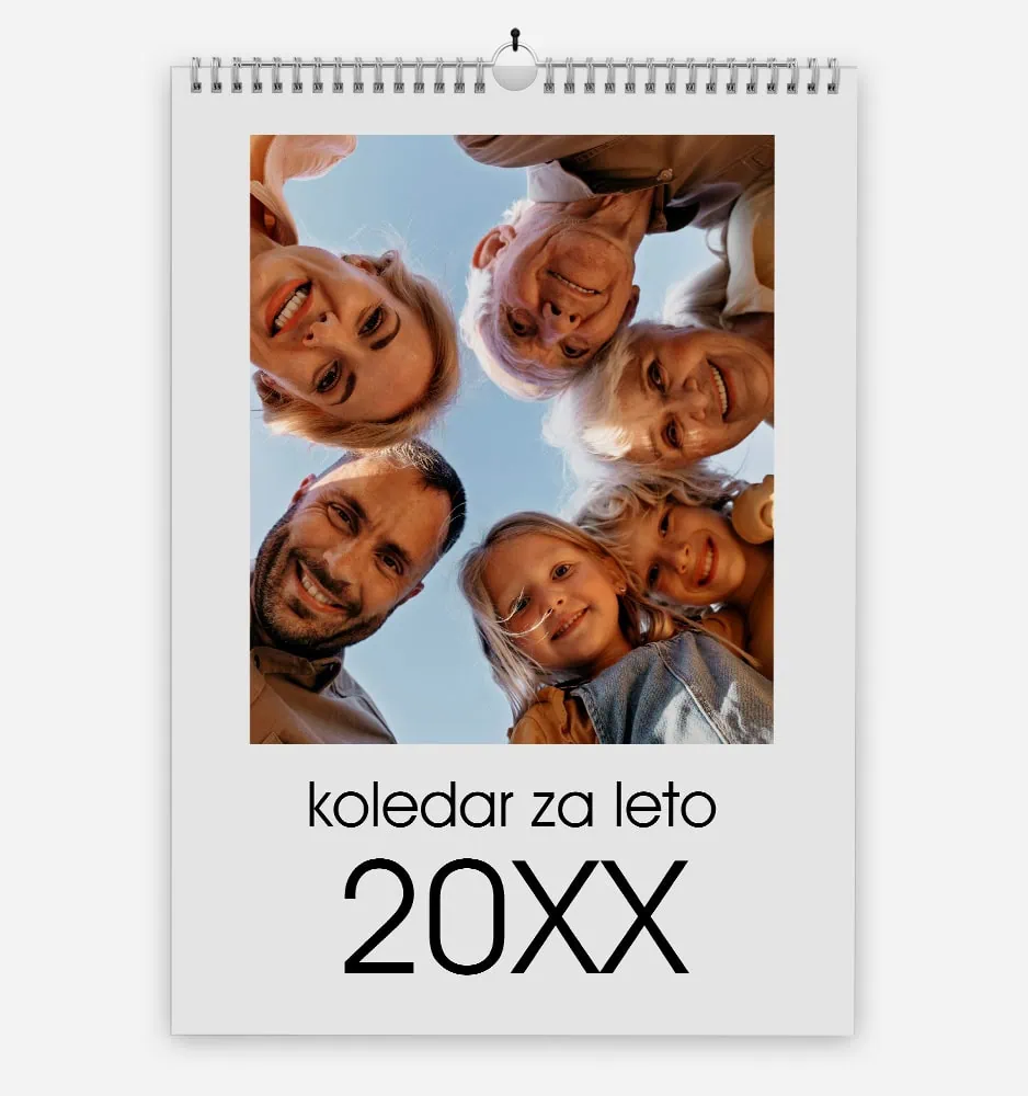 Colorful family photo on a summer calendar with smiling faces and blue sky background.