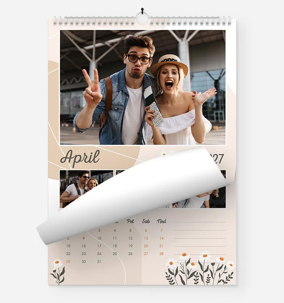 Young couple at train station enjoying travel photos in April.