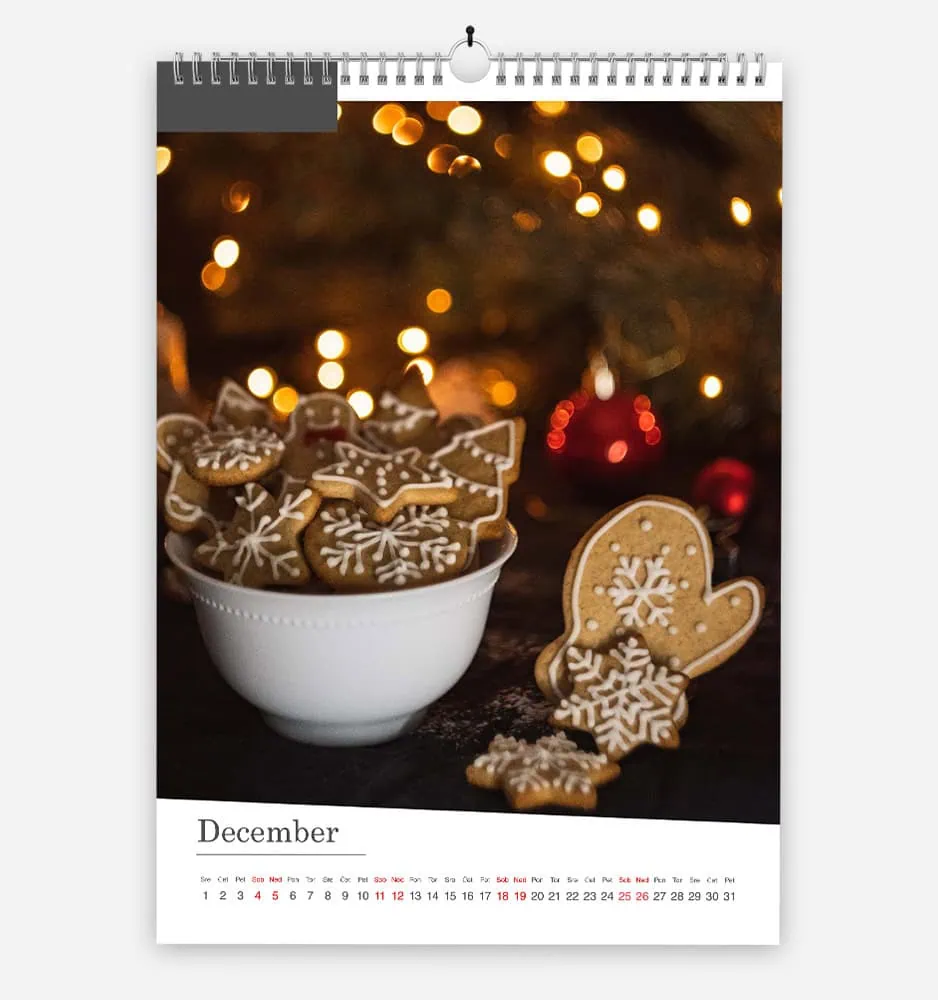 nagnjena_2 Festive gingerbread cookies with snowflake and heart shapes on a Christmas background.