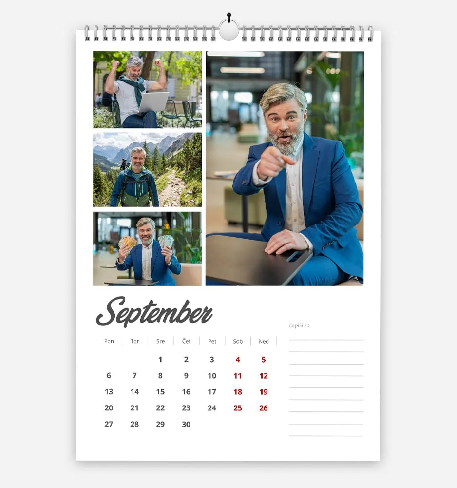 Professional man in a blue suit pointing at the camera in a modern office setting.
