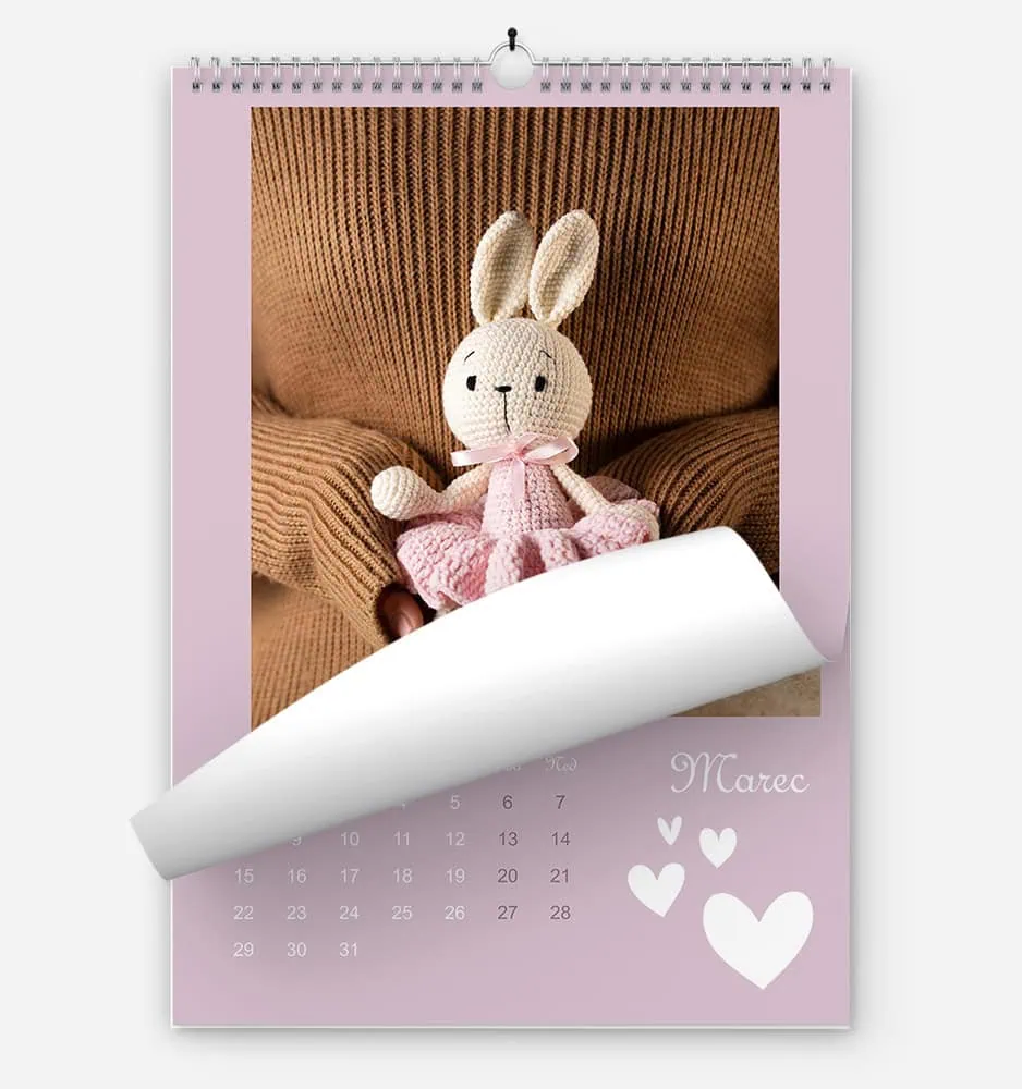 Cute plush bunny doll on a pink calendar with hearts and the name Marec.