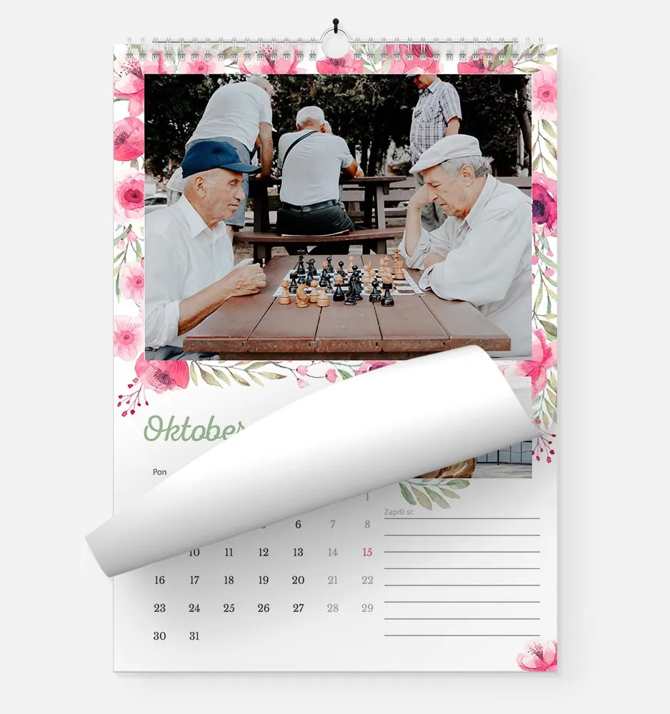 Elderly men playing chess outdoors in a park setting.