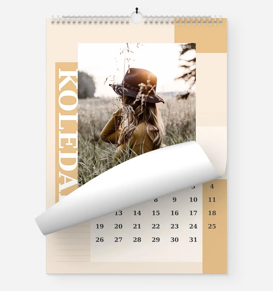 Calendar with a photo of a woman in a hat in a field for FOTO GM.