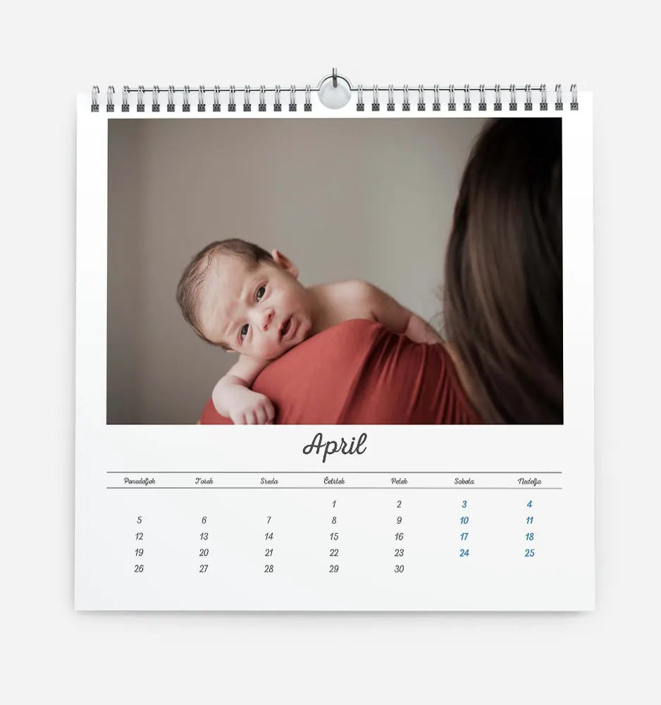bela_dilema_5 Close-up of a baby resting on a woman's shoulder in April calendar image.
