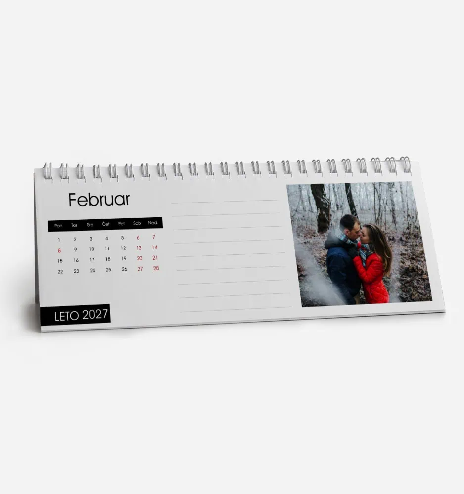 February 2023 desk calendar with a photo of a couple in a forest.
