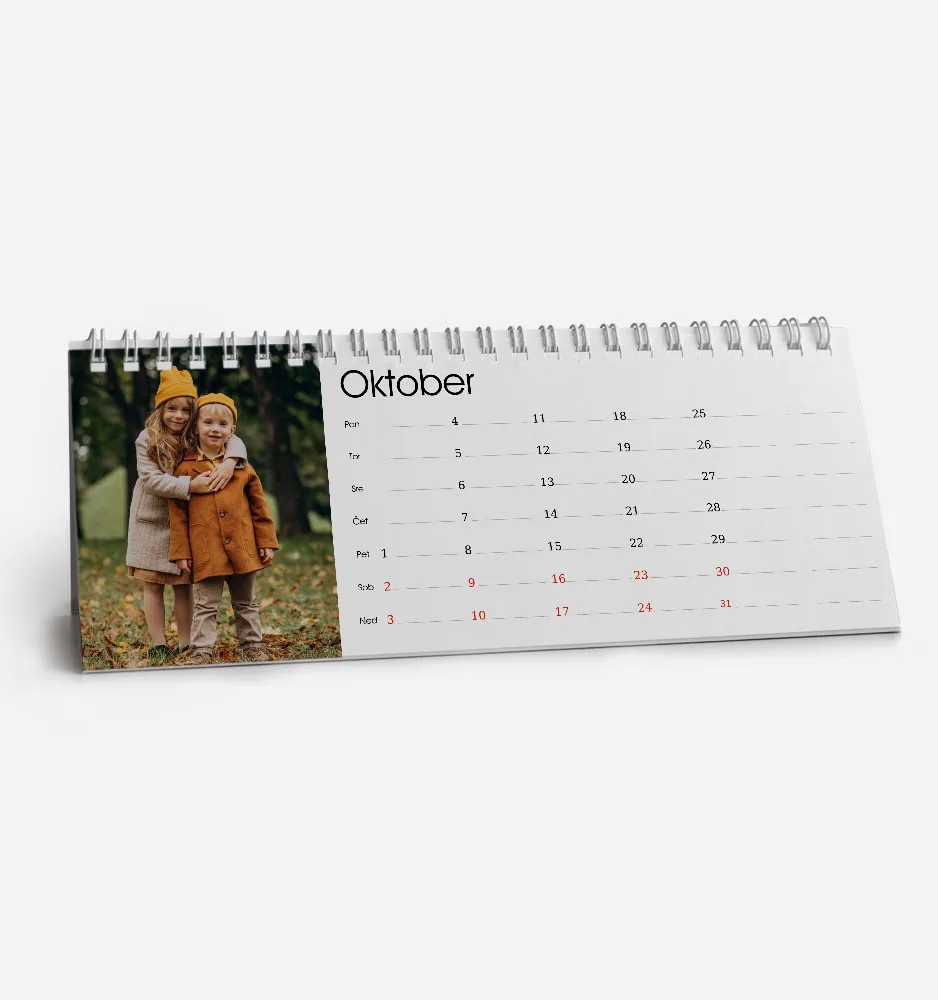 Calendar page for October with a photo of two children outdoors.