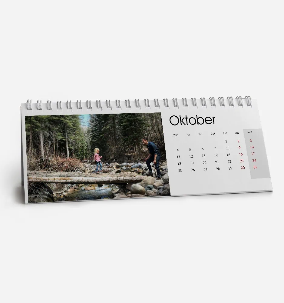 Family enjoying outdoor adventure in forest with stream in October.