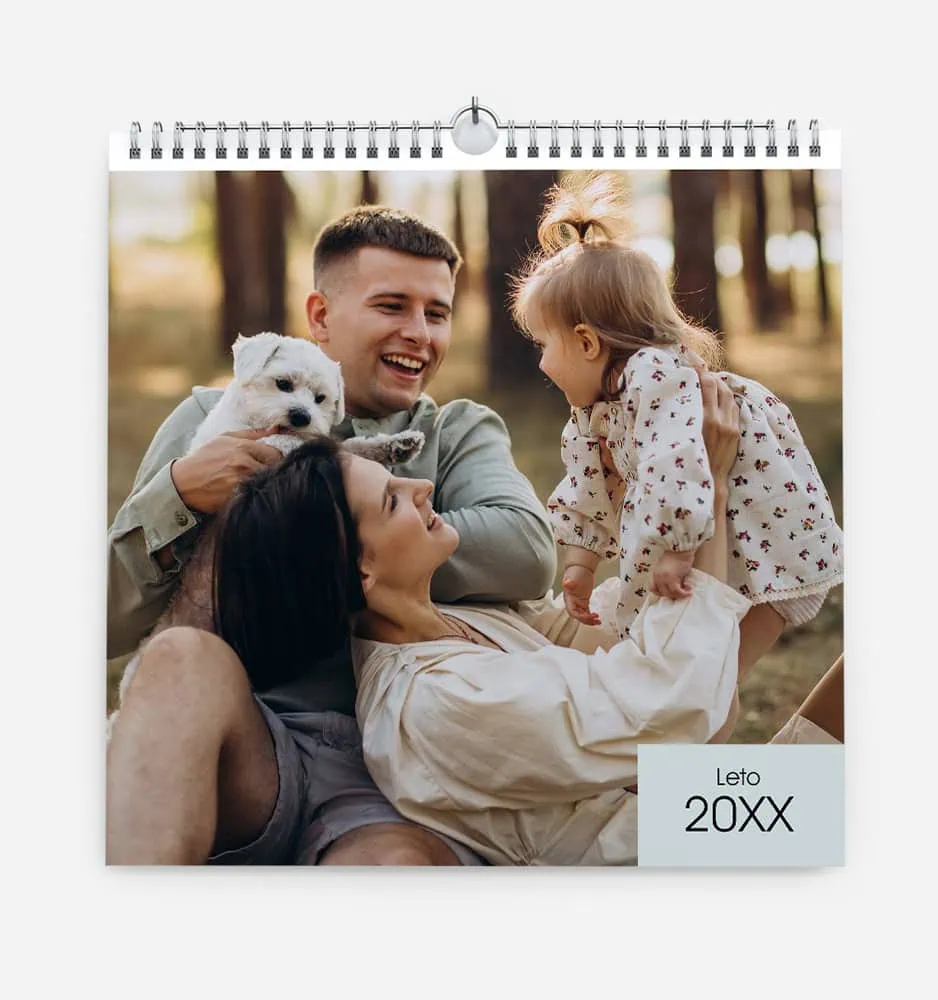 Family enjoying outdoor time with a puppy in a forest setting.