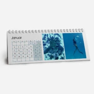 Desk calendar showing January with underwater photos and a diver.