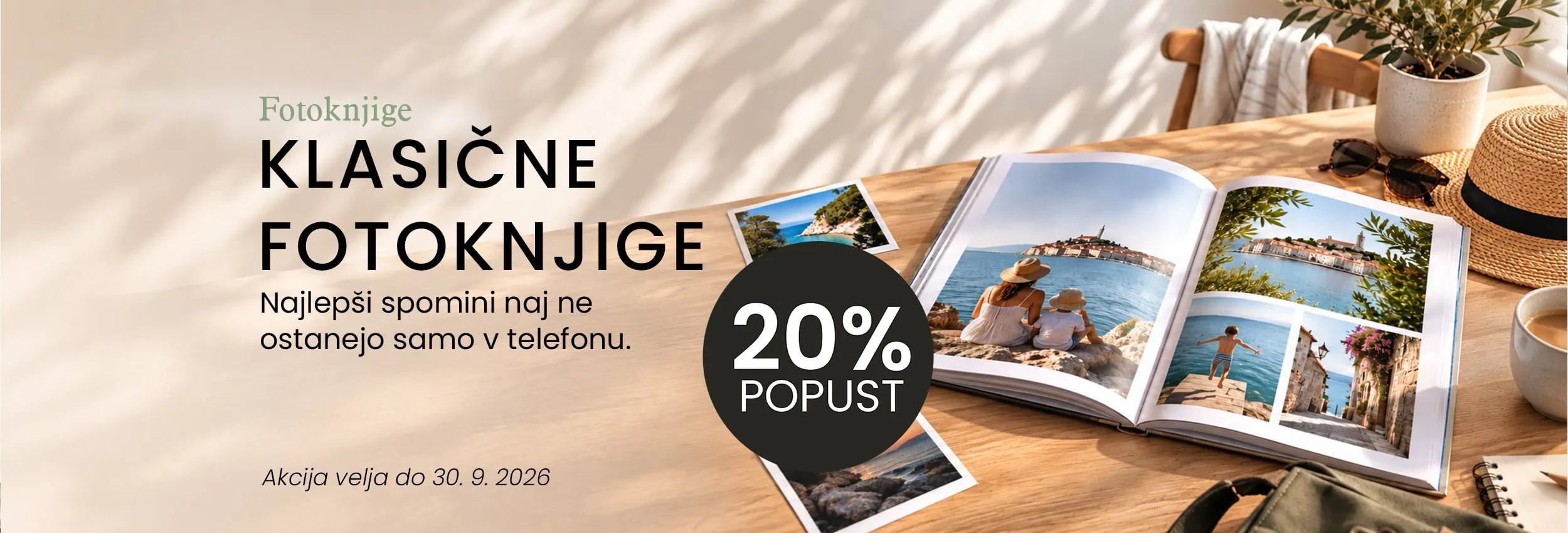 Open photo book with scenic coastal images on a wooden table.