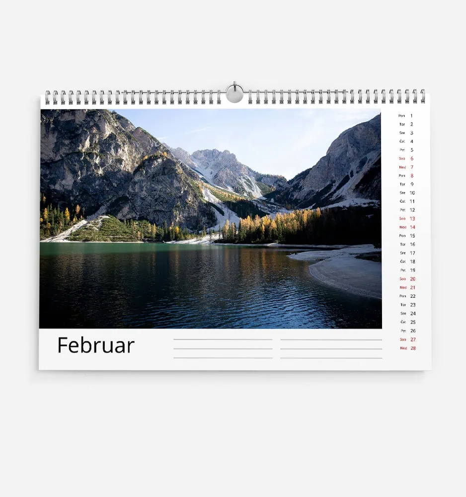 Scenic mountain landscape with lake and forest in February.
