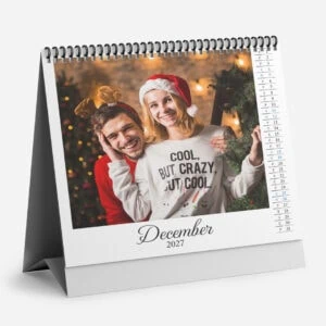 Festive couple celebrating Christmas in December 2023 with holiday decorations.