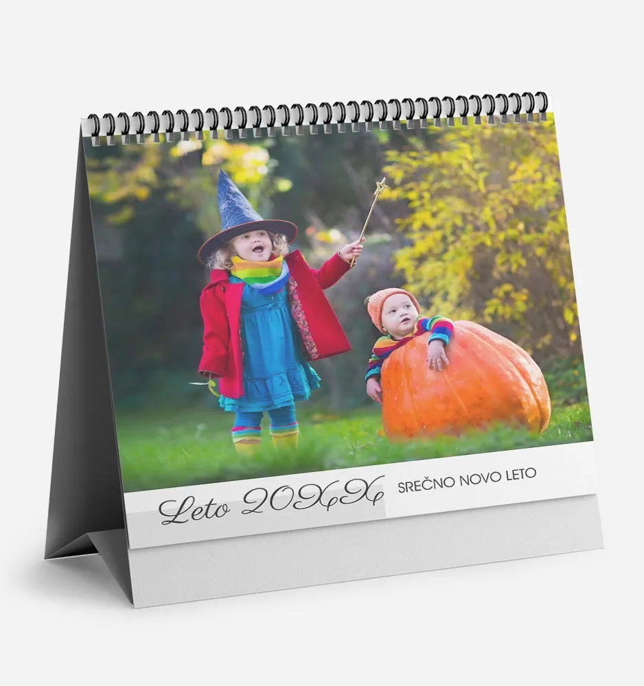 vertikalna_carovnija_k_2 Children in colorful costumes with a pumpkin in a park during autumn.