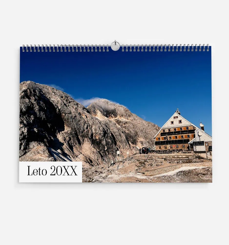 zmig_1 Scenic mountain landscape with a rustic building under a clear blue sky.