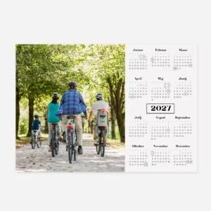 Family riding bikes in a lush green park during daytime in 2027.