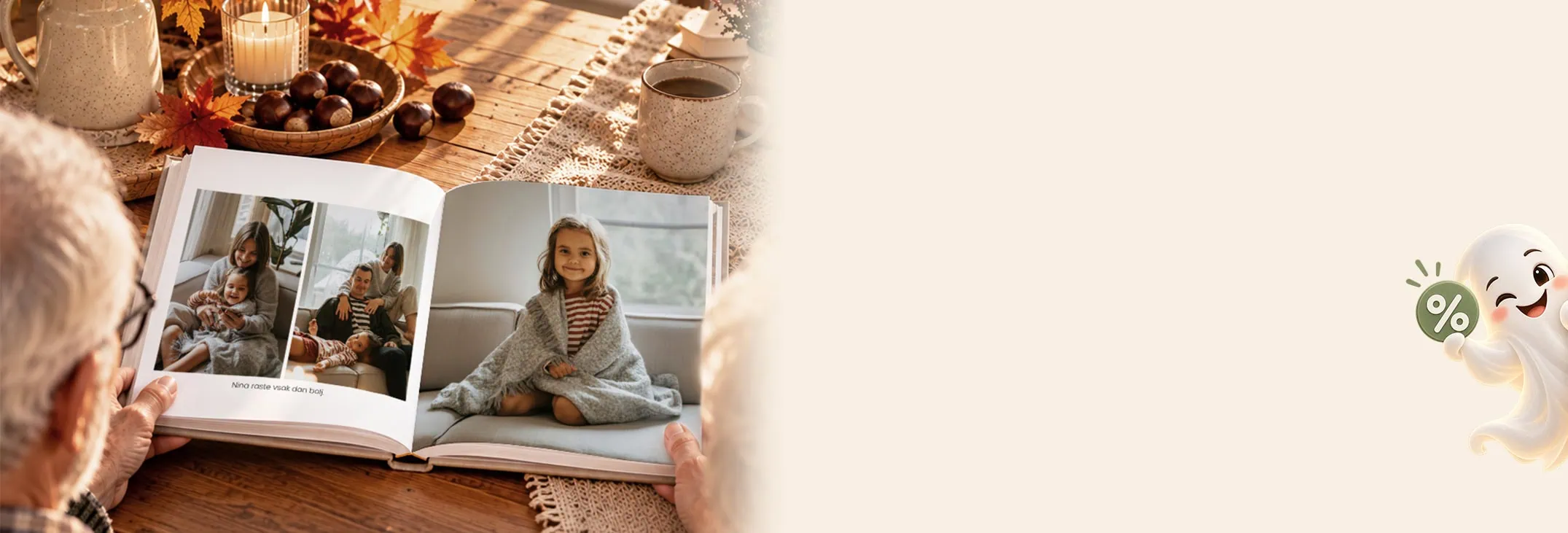 Family looking at photo album on wooden table with candles and autumn decorations.